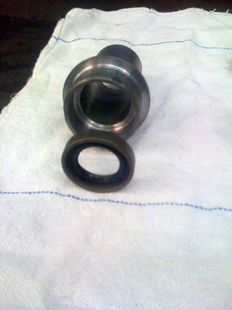 seal retaining area in the back for the input shaft, this will replace the standard input seal without modifying the case